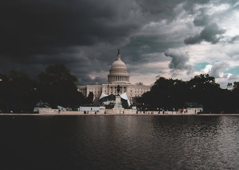 The US Capitol Building against a backdrop of stormy skies in Washington DC.